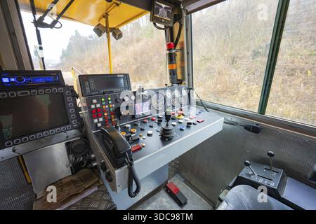 Interior view of a train driver's cab with numerous switch and control buttons, stuffing machine on Hermann, Hesse, Bahn, Althengstett, Calw district Stock Photo