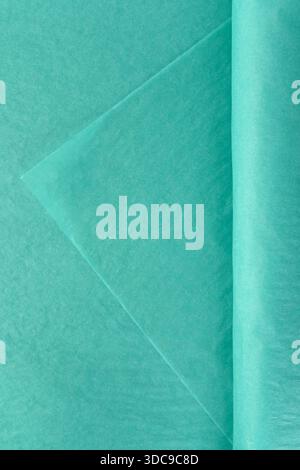 Soft turquoise tissue wrapping material for flowers stacked in sheets isolated on white background used for bouquet presentation decor and packaging Stock Photo