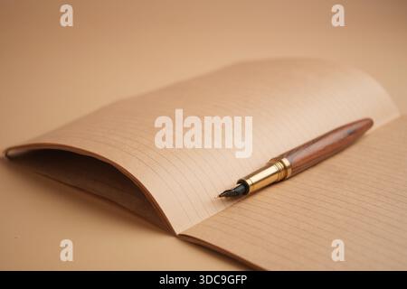 Notebook with fountain pen on a flat surface Stock Photo