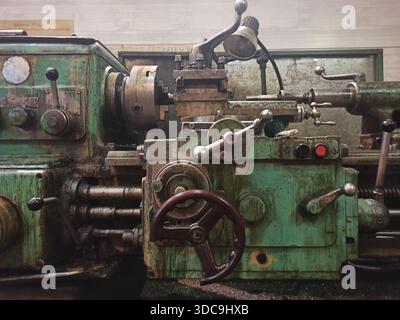 Vintage lathe in the workshop at the factory. Stock Photo