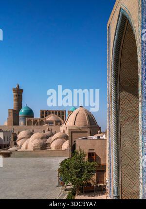 Historical mosque, minaret and bazaar in Bukhara, Uzbekistan Stock Photo
