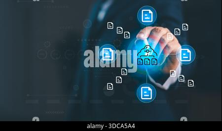 Business professional selecting cloud storage icon with multiple digital file symbols, representing online data management, secure cloud backup, file Stock Photo
