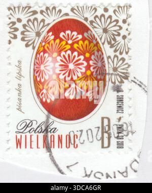 POLAND — 2018 March 6: B-zone gold and multicolored postage stamp depicting Easter egg (Pysanka, Pisanka) from the Lipsk. Eggs and pisanki are hallowed on Easter Saturday along with the traditional Easter basket. Today, in Poland, eggs and pisanki are hallowed on Easter Saturday along with the traditional Easter basket. On Easter Sunday, before the ceremonial breakfast, these eggs are exchanged and shared among the family at the table. This is a symbol of friendship, similar to the sharing of the Opłatek (Christmas wafer) on Christmas Eve Stock Photo