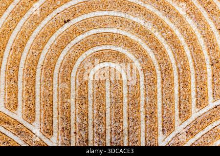 Close up view of textured doormat pattern with abstract lines blurred and out of focus on neutral background. Stock Photo