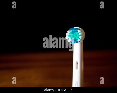 Electric toothbrush head on dark background Stock Photo