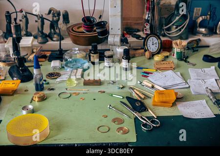 Workbench full of various specialised tools of the watchmaking trade Stock Photo