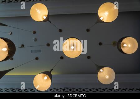 Bottom view of modern ceiling lights. Lighting decoration concept. Modern hanging ceiling lamps Stock Photo