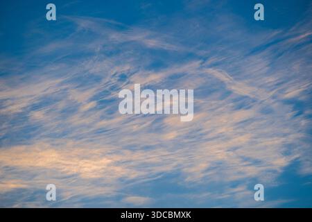 Blue sky with white clouds during sunset, texture and background Stock Photo