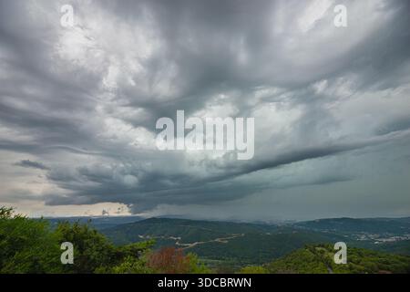 Wall cloud of a rotating supercell over the coastal mountains at the Adriatic coast near Koper, Slovenia Stock Photo