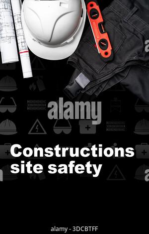 Focus on construction site safety with gear and tools on the surface Stock Photo