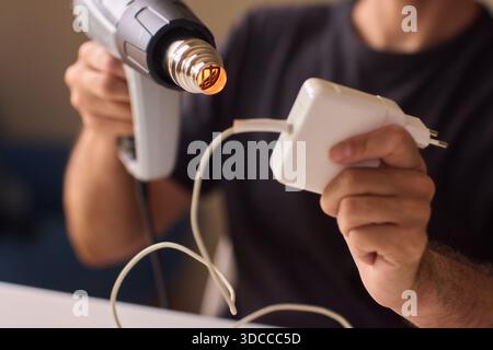 Utilizing a Heat Gun for a Wide Range of Different DIY Projects and Applications Stock Photo
