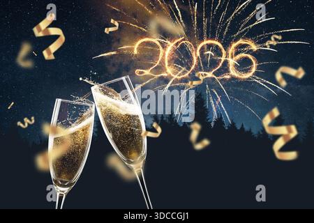 Two champagne glasses clinking with 2026 sparkler numbers and fireworks in the night sky. Festive New Year celebration with golden confetti, forest si Stock Photo