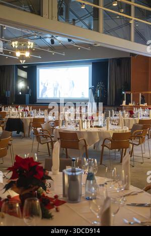 Elegant banquet hall with set tables and large screen in a festive atmosphere, Christmas party Dekra Congresshotel Wart, Calw district, Germany Stock Photo