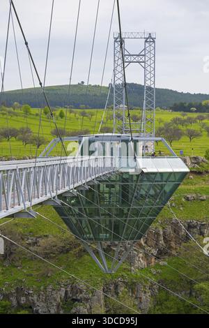 Bridge with glass structure over a green landscape and hills, diamond bridge, Diamond Glass Bridge, world's longest free-hanging structure, Dashbashi Stock Photo