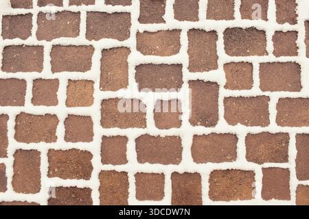 Winter snow covered pavement texture, abstract background Stock Photo