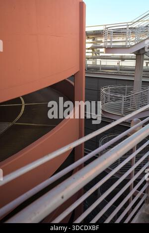 Spiral shaped ramp of a parking lot next to another building seen from ...