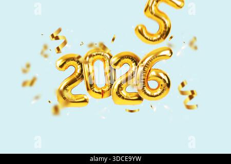 Golden 2026 foil balloons floating amidst falling confetti on a light blue background. Festive, dynamic, and fun concept for New Year's Eve, party inv Stock Photo