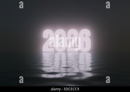 2026 glowing brightly above a dark, rippling water surface. The minimalist and high-contrast scene suggests a focus on the future emerging from the un Stock Photo