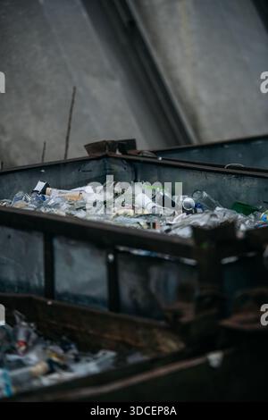 Glass Waste in Metal Container Stock Photo