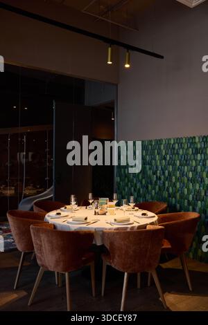 Dining setup in a modern restaurant with chairs and table Stock Photo