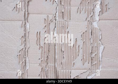 Torn Corrugated Cardboard Texture Background, Grunge Recycled Paper Texture with Peeling Layers. Stock Photo