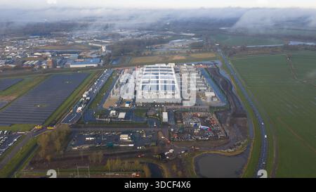 Aerial drone video of the Winschoten data center in The Netherlands, highlighting large-scale cloud computing infrastructure powered by solar energy, Stock Photo