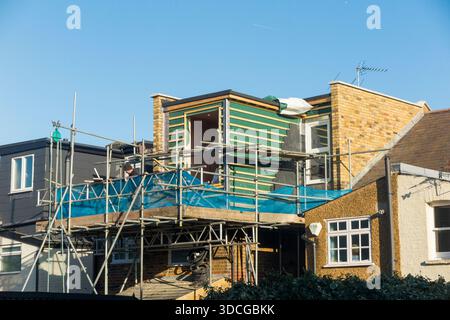 Scaffolding & dormer / dormers / dormas / dorm in process of being built / roof extension on a Victorian terraced house in Twickenham. London. UK. (146) Stock Photo