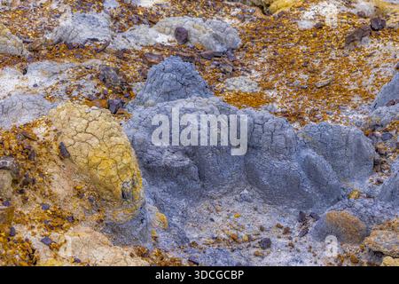 View of cracked earth in shades of yellow, grey and orange, creating a textured and otherworldly landscape, Shetpe, Mangystau Region, Kazakhstan. Stock Photo