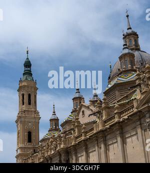 A close-up view of a historic building with ornate architecture, featuring domes and spires against a blue sky Stock Photo