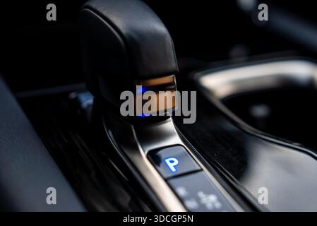 Lexus RX 450h plus gear selector with blue P indicator indoors Stock Photo