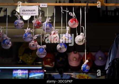 Vienna, Austria - October 5, 2025 - Christmas-themed glass balls (Glaskugel) displayed in a souvenir shop at Hundertwasser Village. Stock Photo