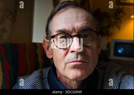 portrait of middle aged man wearing spectacles in the home Stock Photo