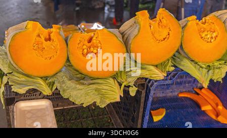 Large Pieces of Orange Flash Cut Pumpkins at Farmers Market in Turkey Autumn Season Stock Photo