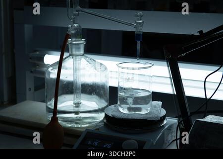 Laboratory setup with glassware and liquid in a beaker Stock Photo