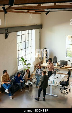 High angle view of business colleagues having meeting in startup office Stock Photo