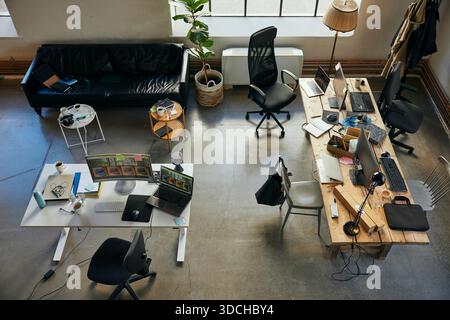 High angle view of office supplies on desk in startup tech hub Stock Photo