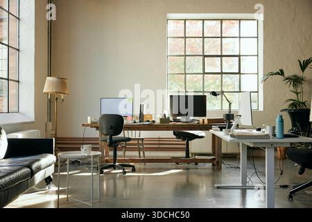 Computers kept on desk in new tech hub Stock Photo