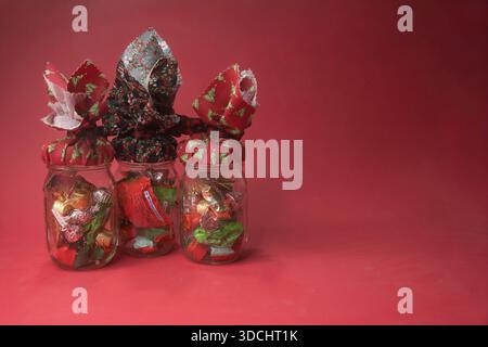 Christmas baske gifts on red background. Stock Photo