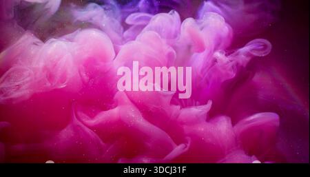 Acrylic shimmer water. Paint flow. Blur pink purple color rainbow liquid sparkling cloud spreading on abstract smoke art background. Stock Photo