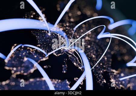 Planet Earth at night with glowing network lines connecting countries, symbolizing global communication, internet technology, data exchange, and world Stock Photo