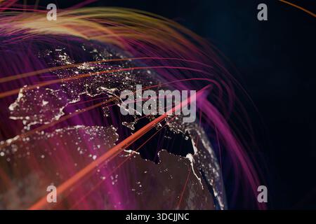 Earth at night with colorful digital lines representing global communication, internet networks, data transfer, and worldwide technology connectivity Stock Photo