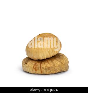 Two healthy dried figs, isolated on a plain white background Stock Photo