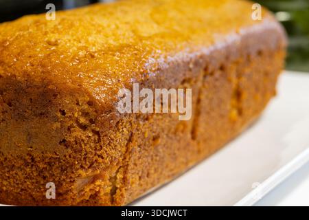 Gourmet artisan cake loaf shot with shallow depth of field highlighting the rustic homemade appearance and appetizing color Stock Photo