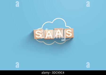 Wooden cubes SAAS on blue background with cloud, top view. Technology, IT and business. Management, creative idea Stock Photo