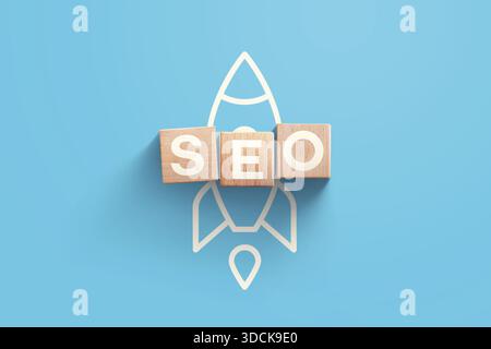 SEO, creative idea. SEO wooden blocks with rocket icon on blue background, top view. Start up and successful launch, concept. Marketing and traffic. A Stock Photo