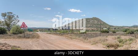 landscape with crossroads between n°10 and R400 roads on flat countryside, shot in bright late spring light near Kommadagga, Karoo, Eastern Cape, Sout Stock Photo