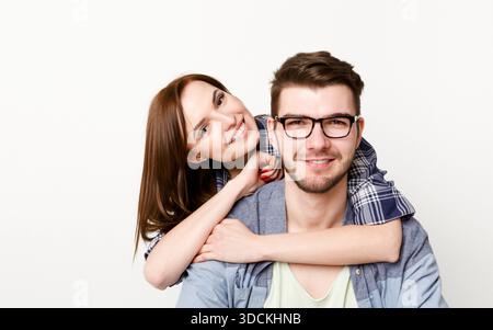 Happy casual couple posing to camera, isolated Stock Photo