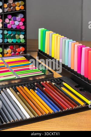 Colorful pencils, markers, felt-tip pens on table. Bright creative background for education, school, art, design, stationery, office, learning, childh Stock Photo