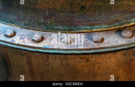 Abstract industrial pipeline fragment, rusty flange. Rusty nuts and bolts on the old equipment Stock Photo