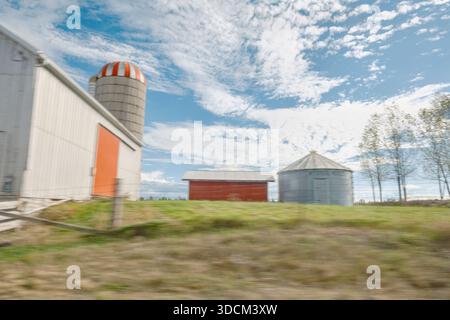 Small farm with silo and two grain bins Stock Photo